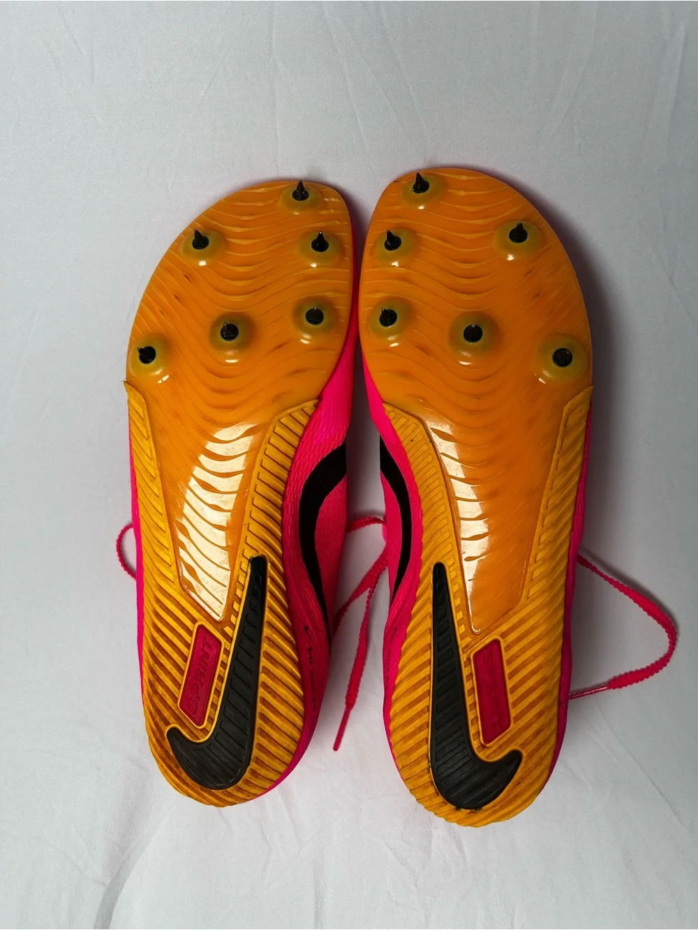 Nike Bright Pink Athletic track with Black Swoosh men’s 10/1/2
